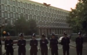 Police standing in front of building