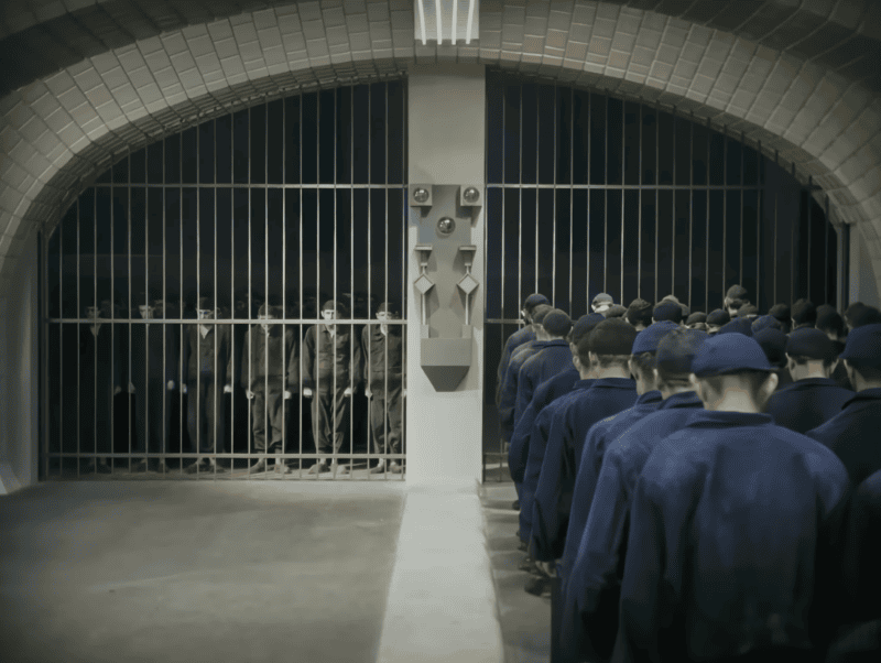 Workers robotically heading into the factory