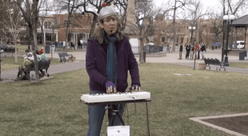 The Space Lady performing in a park